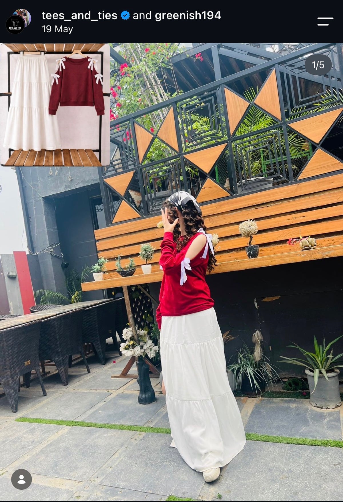 Customer in a red top with white wide leg trousers at a cafe