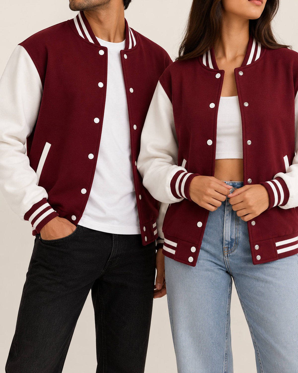 Maroon baseball jacket with white sleeves worn by a man and a woman, front view