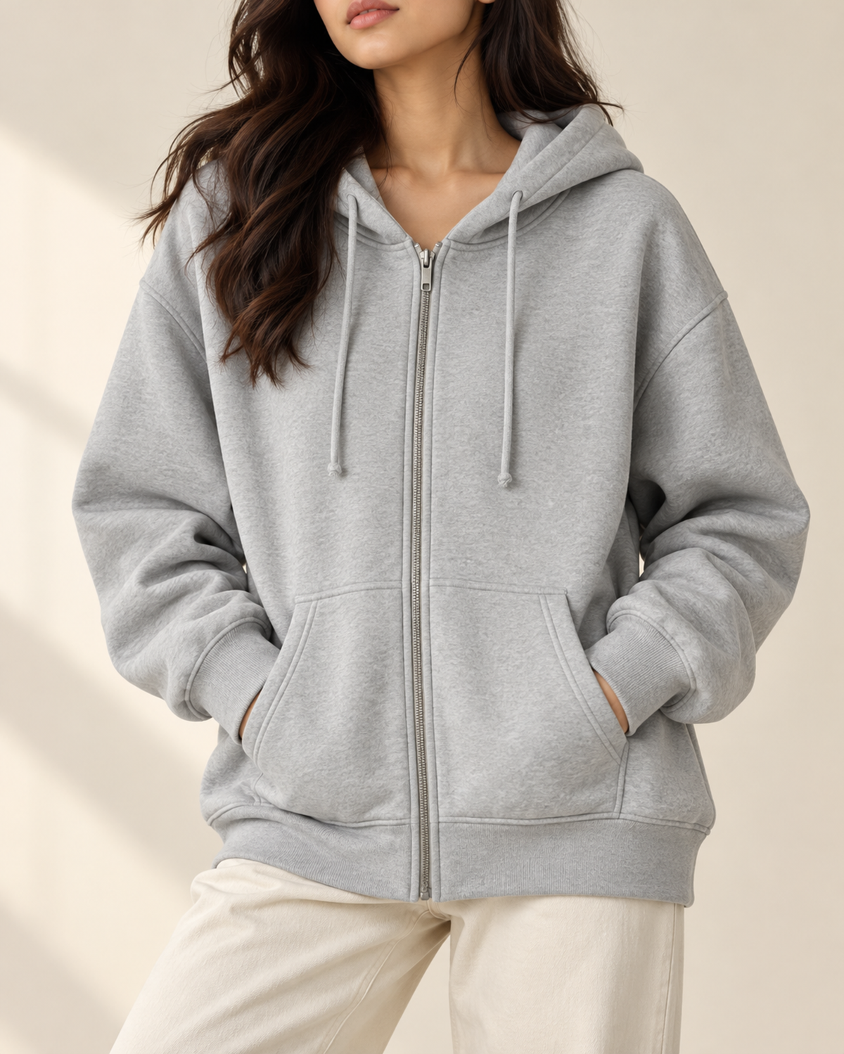 Grey oversized zip-up hoodie with a drawstring hood, by TeesnTies, view 1 of 4