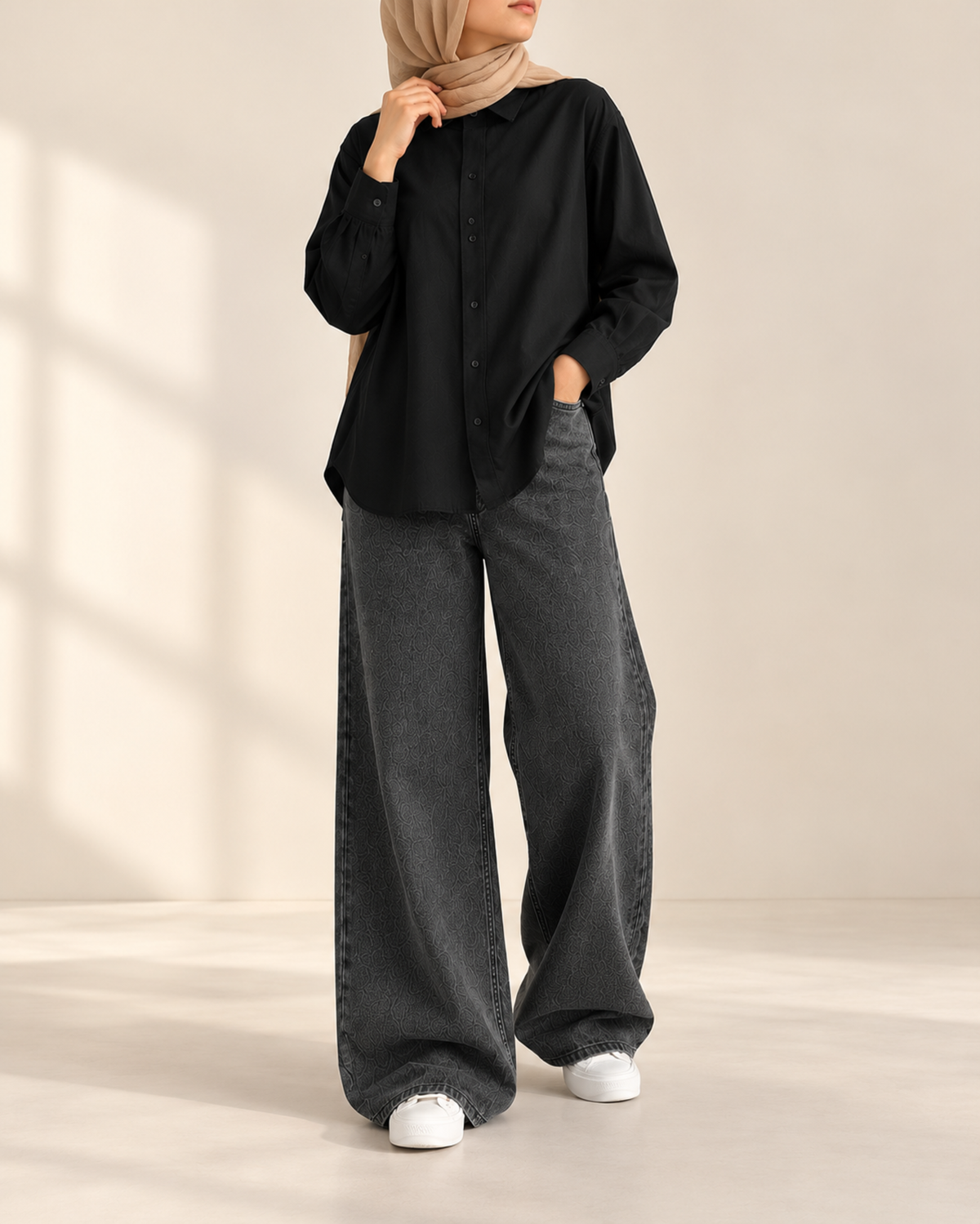 Oversized black button-down shirt with charcoal wide-leg jeans, front view