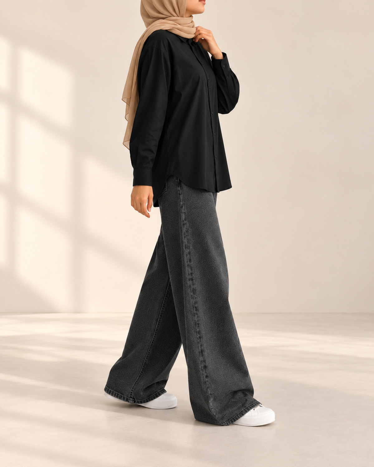 Black button-down shirt and charcoal wide-leg jeans, side view