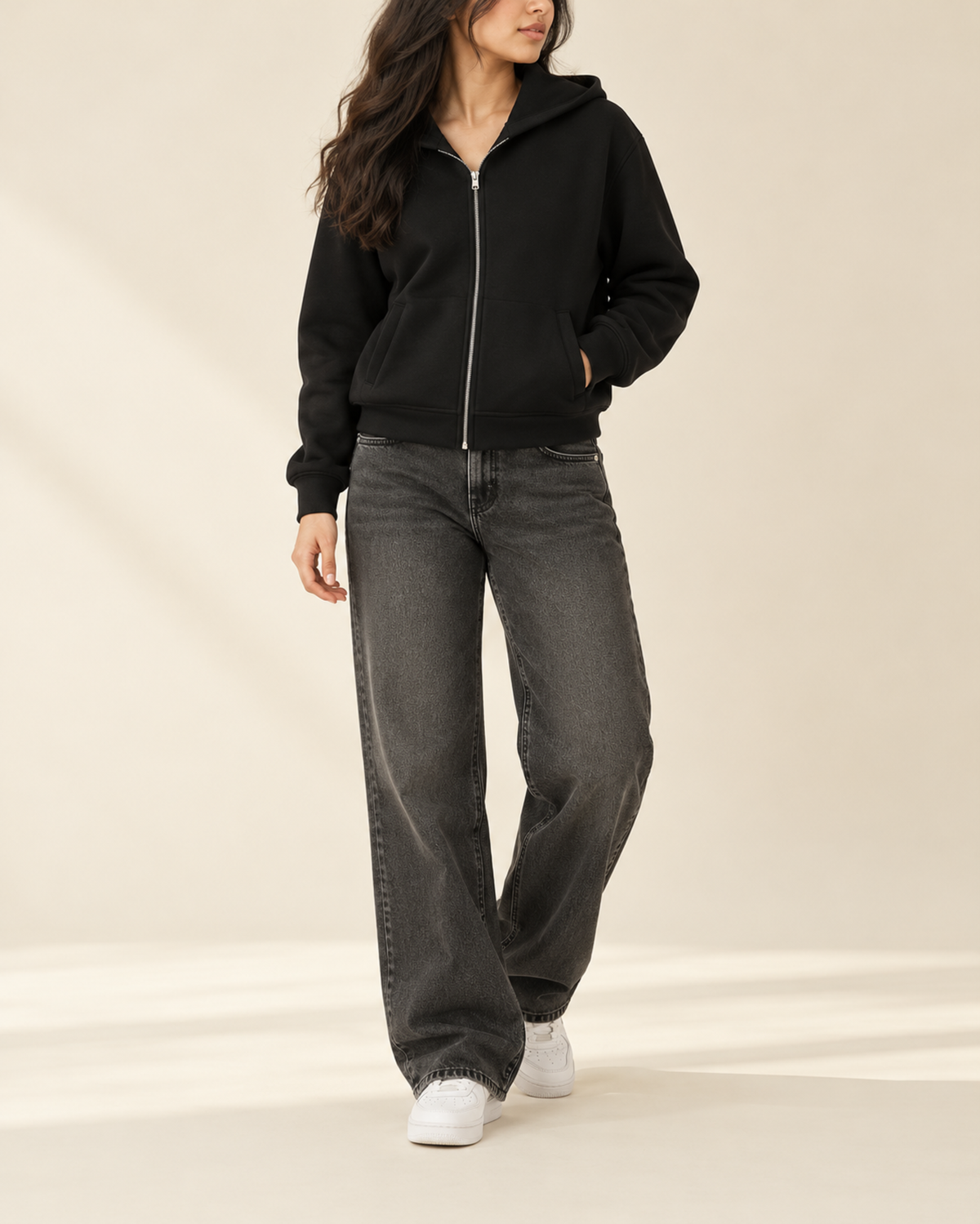 Black zip-up hoodie with charcoal wide-leg jeans, front view