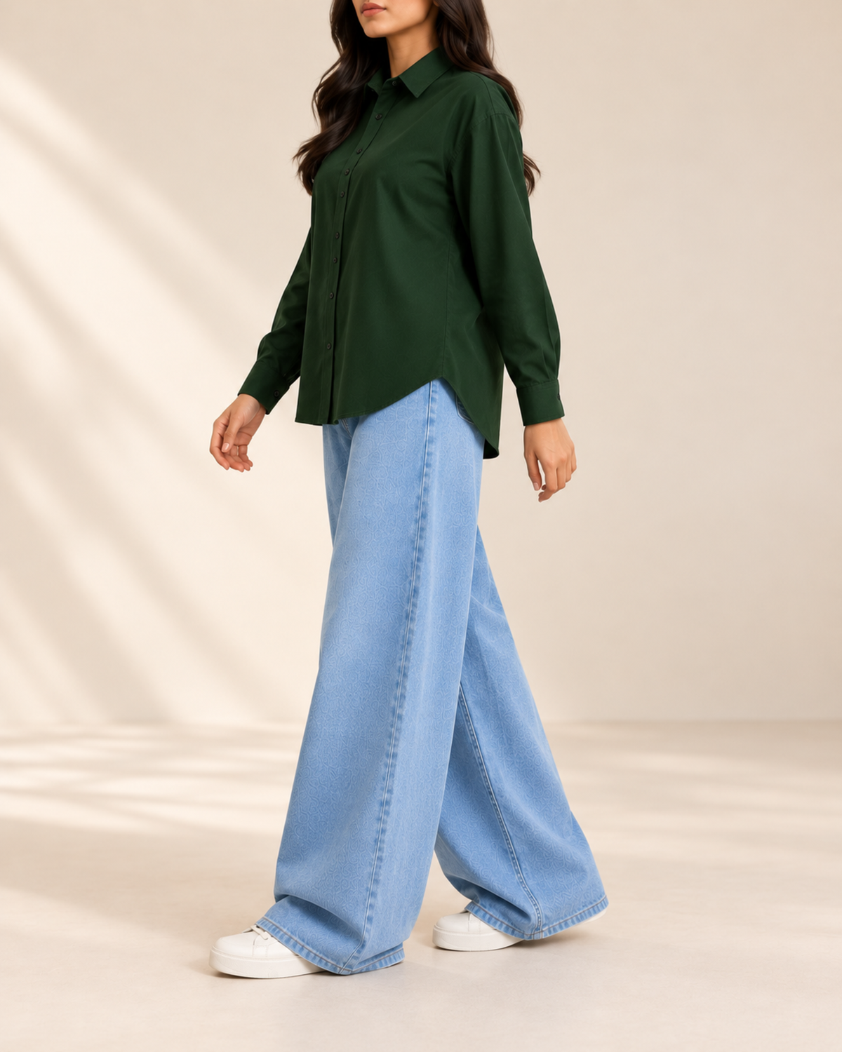 Bottle green button-down shirt and sky blue wide-leg jeans, side view