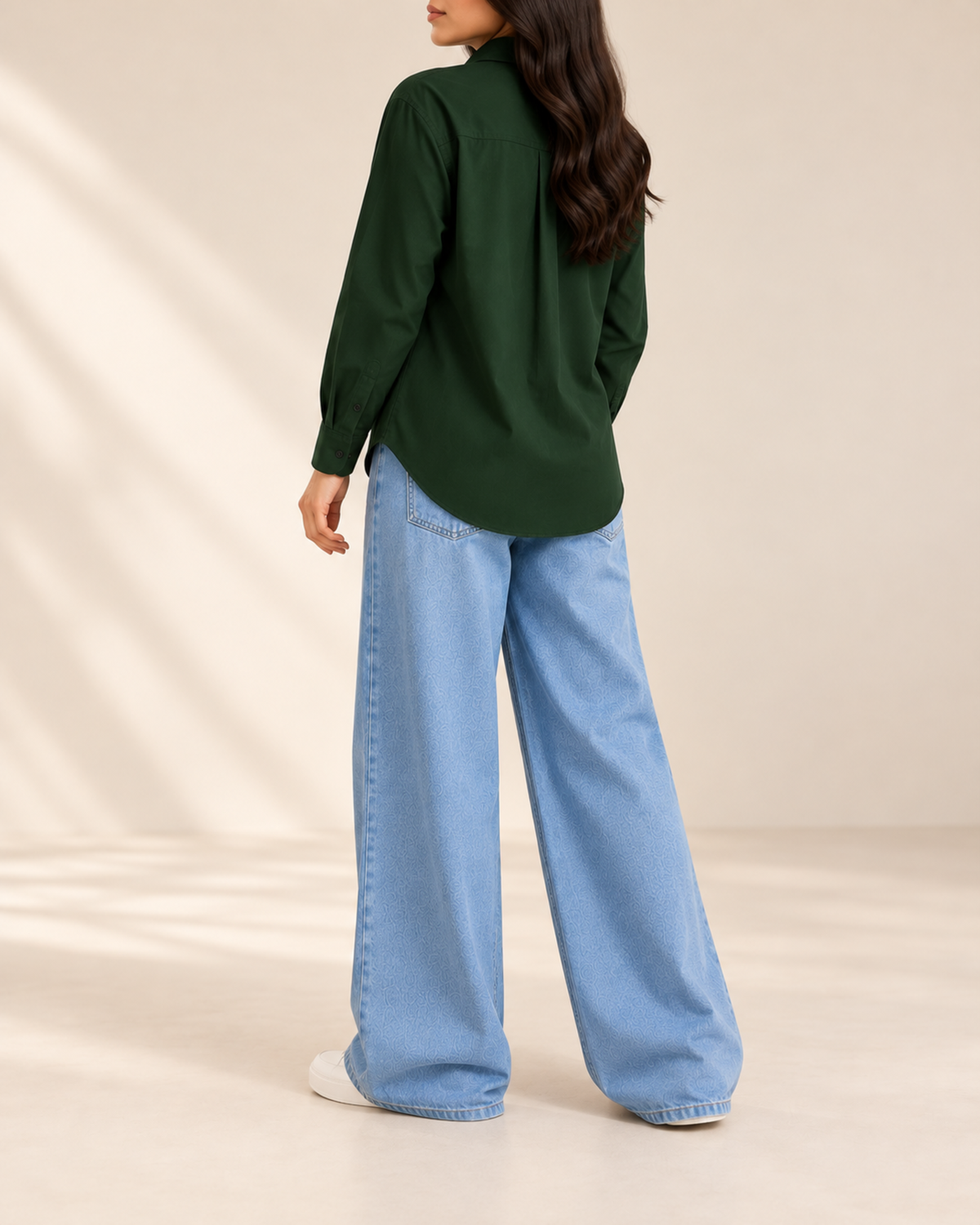 Back view of bottle green button-down shirt with sky blue wide-leg jeans
