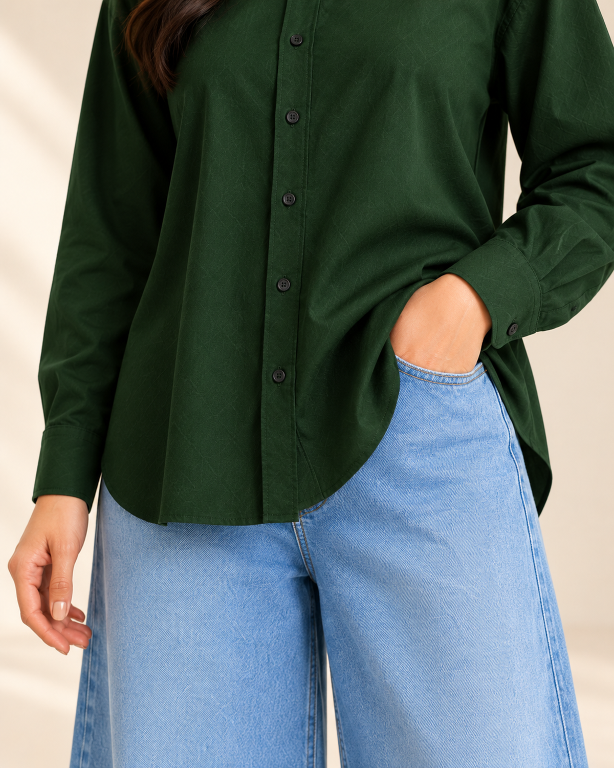 Close-up of bottle green button-down shirt with sky blue denim jeans