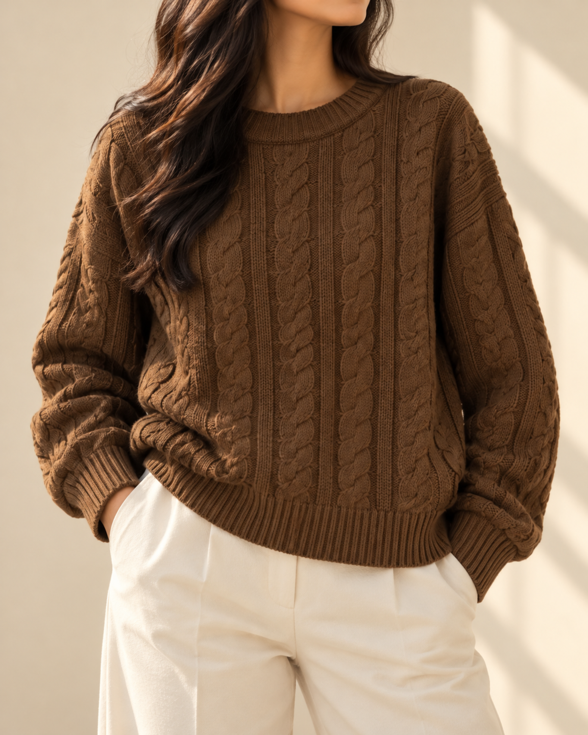 Woman wearing the brown Aspen cable knit pullover, view 1 of 4
