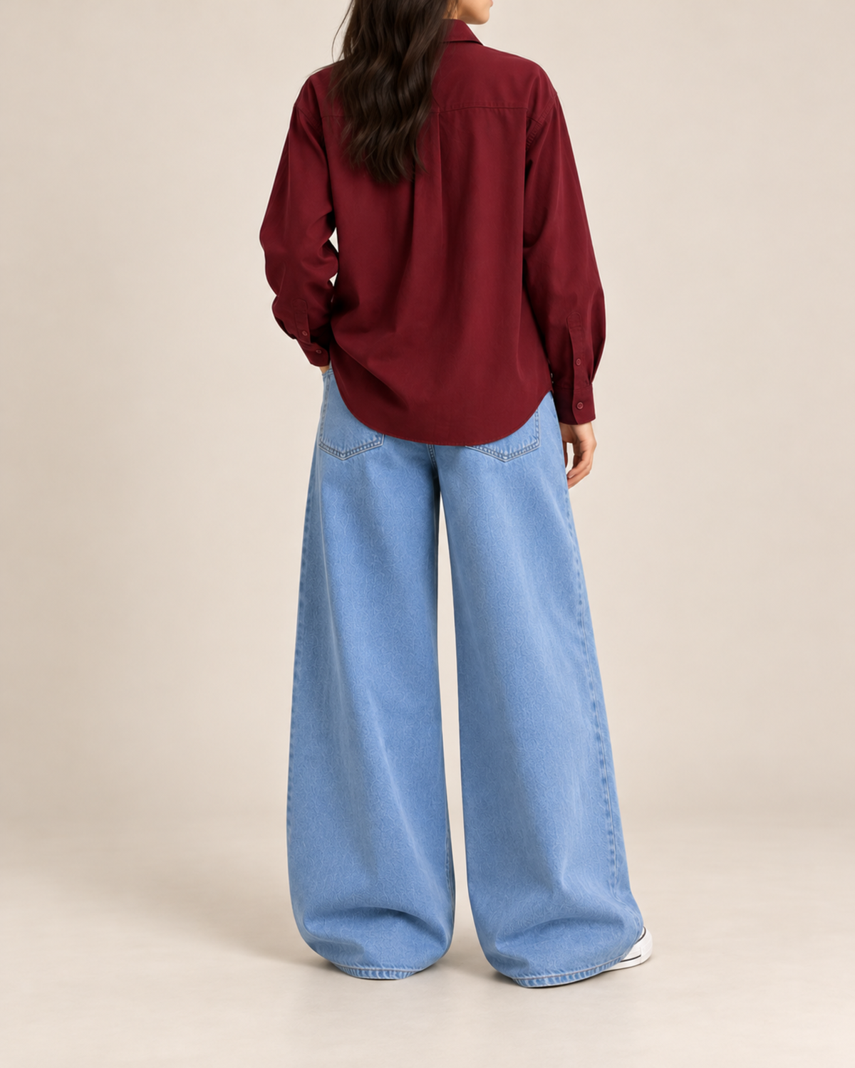 Back view of maroon button-down shirt with sky blue wide-leg jeans