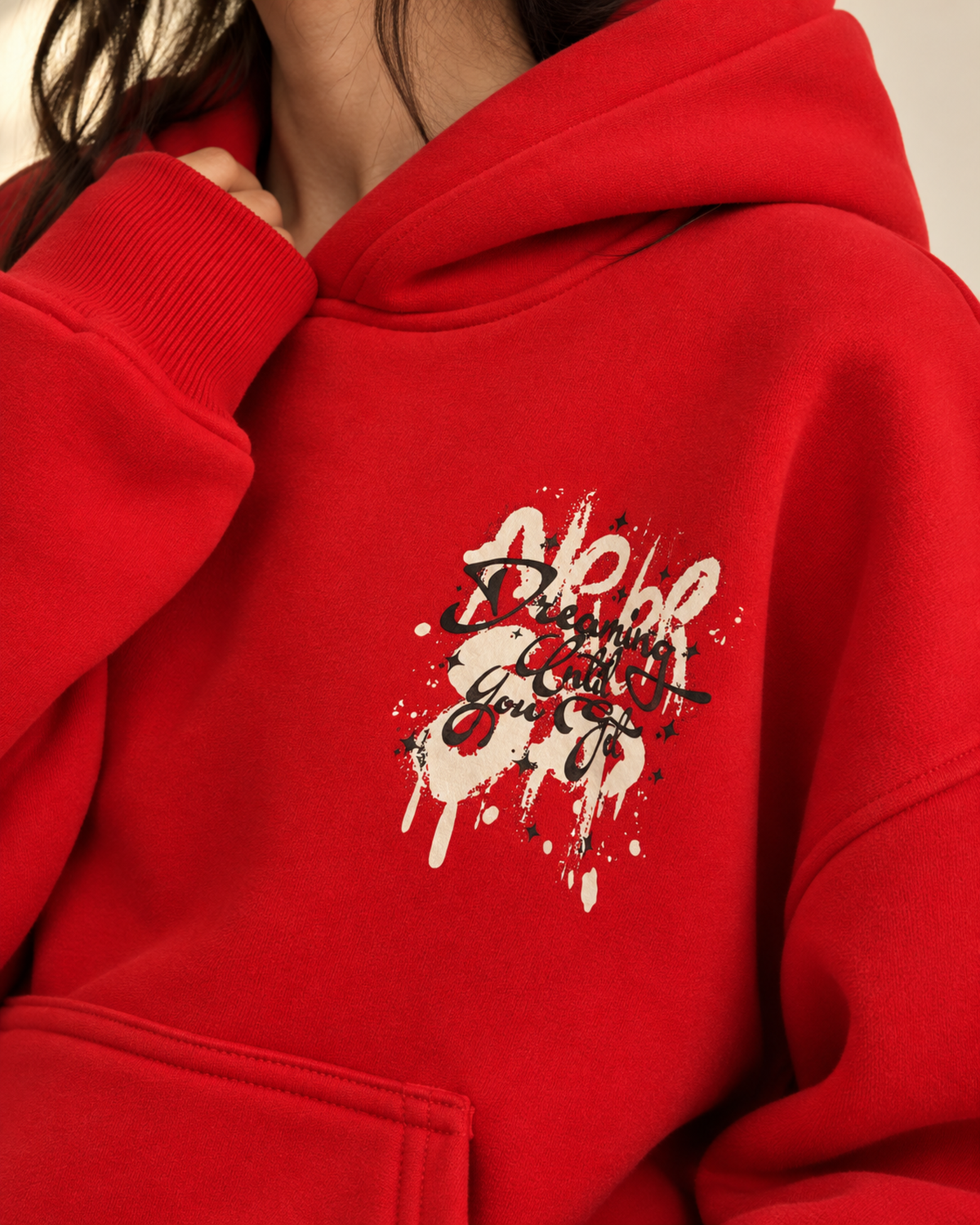 Close-up of graffiti-style chest print on red hoodie