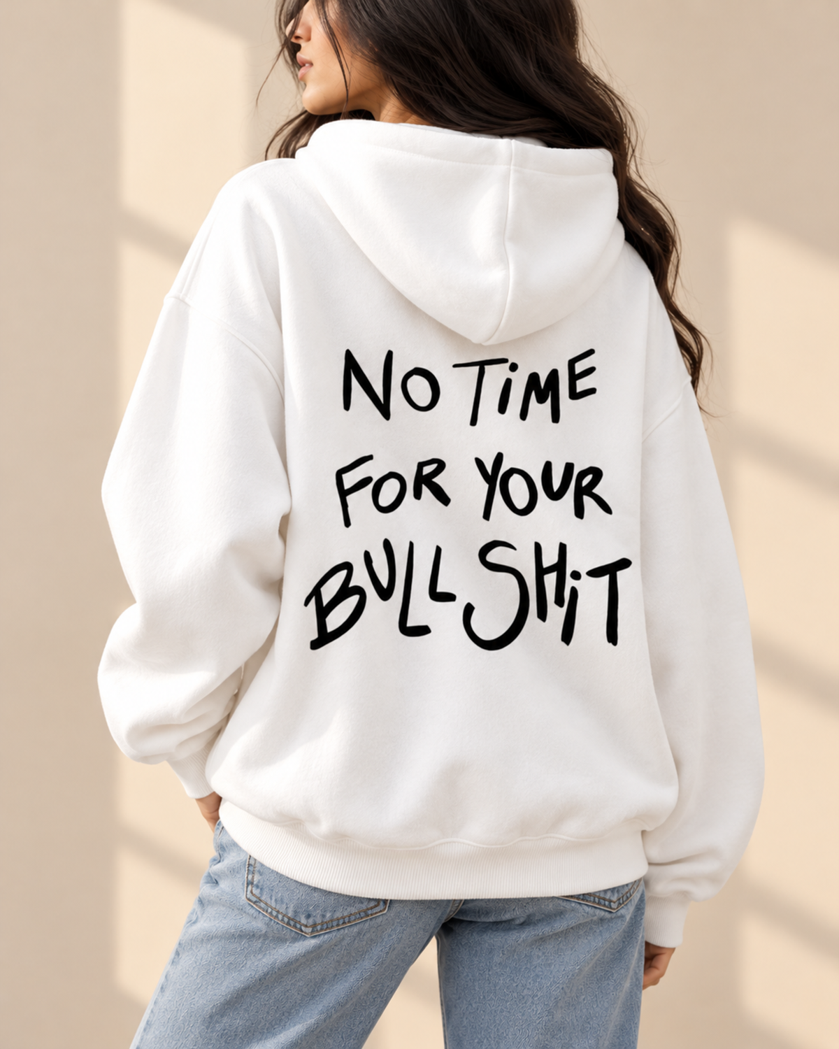 Back view of white hoodie with black handwritten slogan print