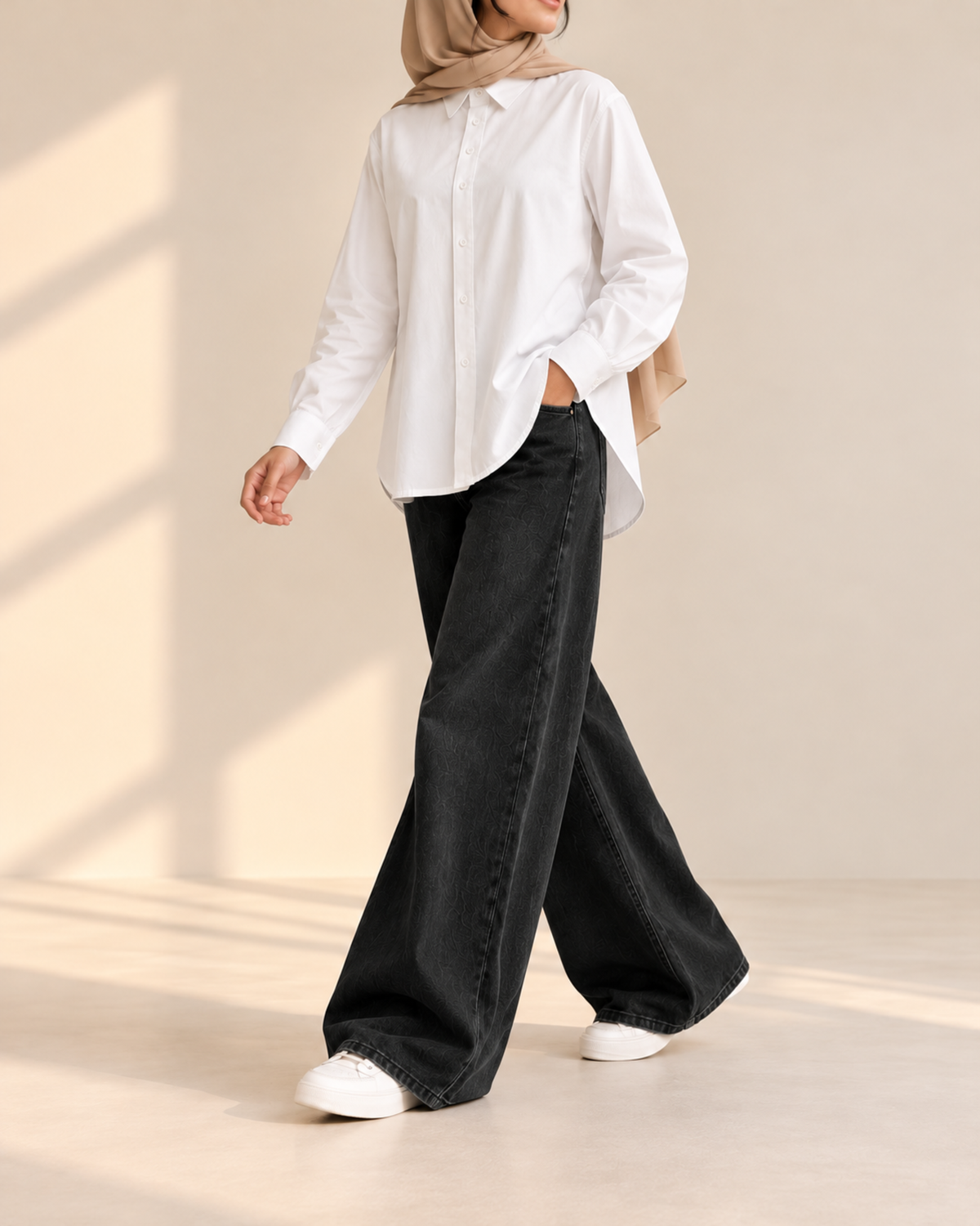 White button-down shirt and black wide-leg jeans, side view