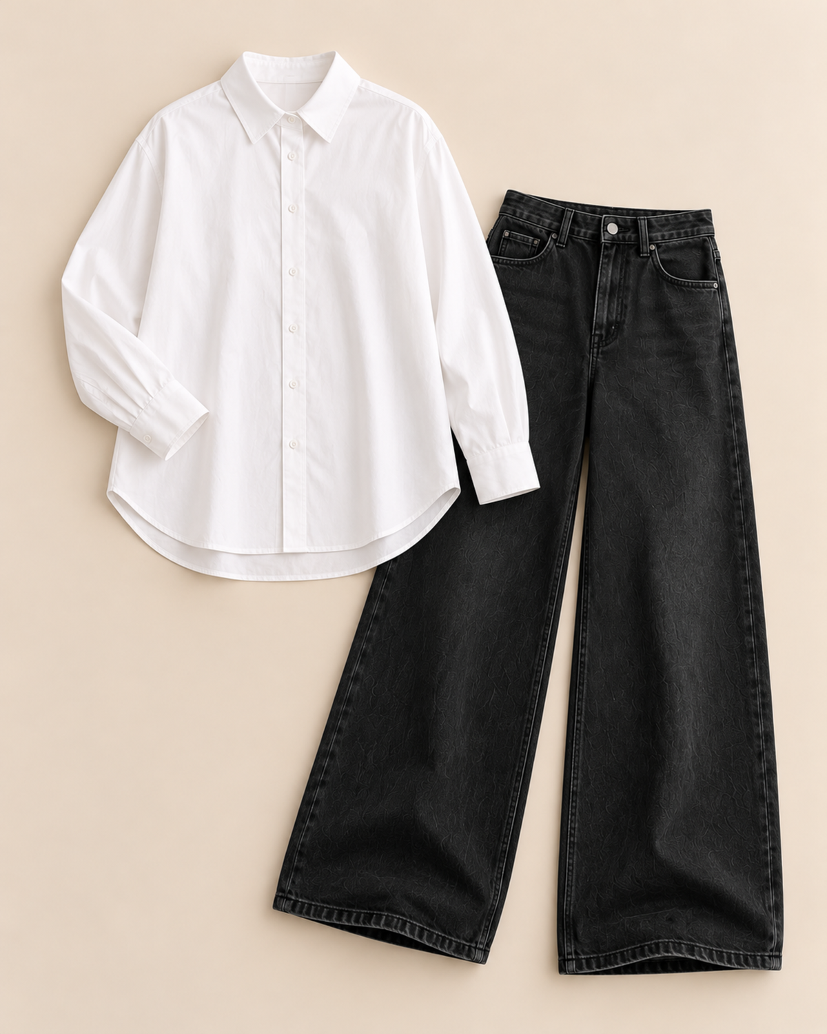Flat lay of white button-down shirt and black wide-leg jeans